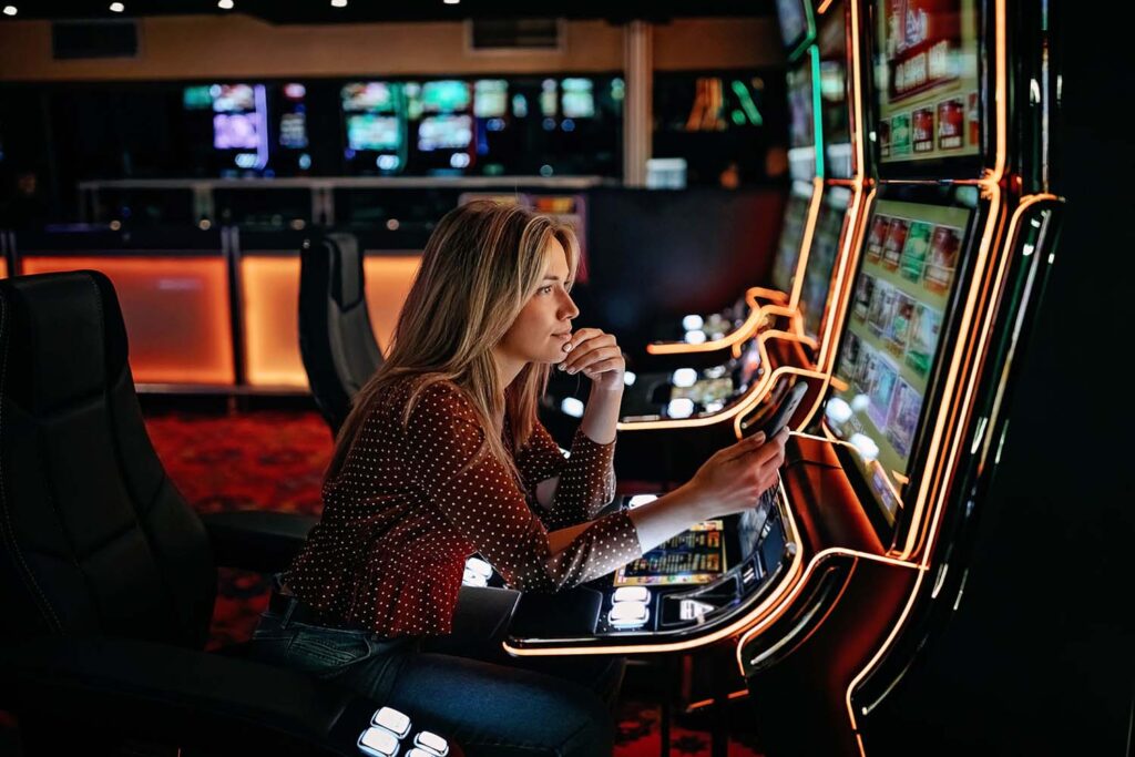 woman playing penny slots
