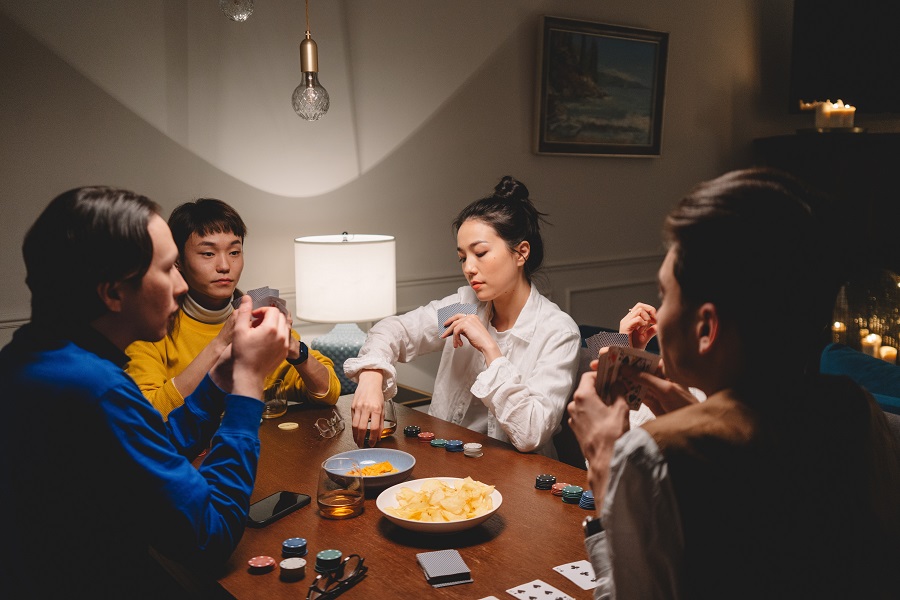people playing poker at home table